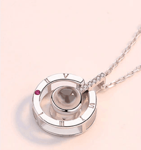 Colgante reloj de sol en plata "100 maneras de decir te amo"